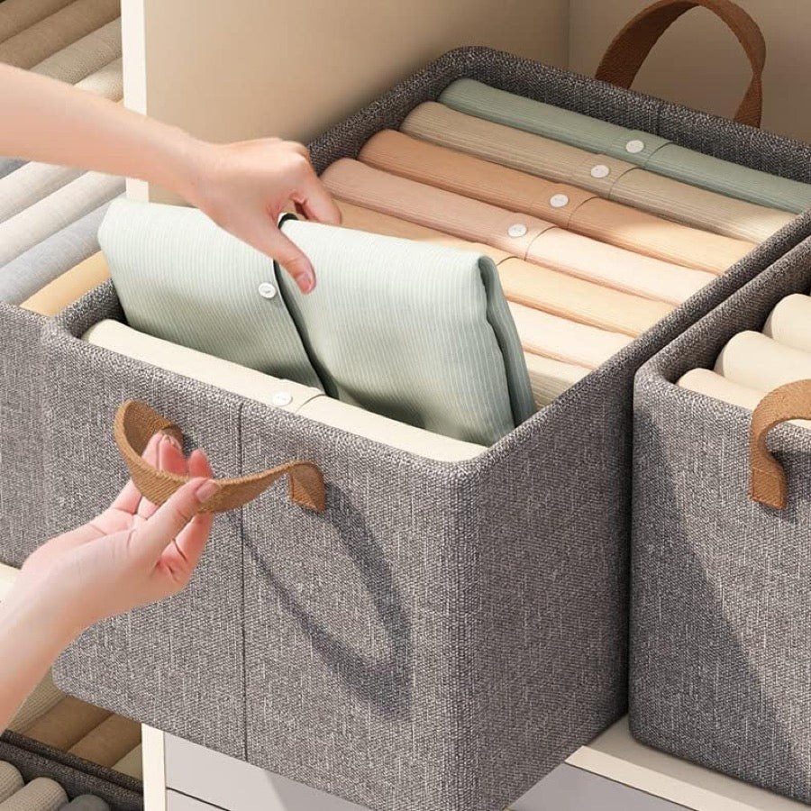 Folded shirts standing in rows inside an organiser
